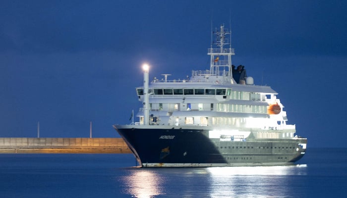The Dutch-flagged hantavirus-stricken cruise ship MV Hondius anchors at the industrial port of Granadilla de Abona, Tenerife, in the Canary Islands, Spain, early on May 10, 2026. — AFP