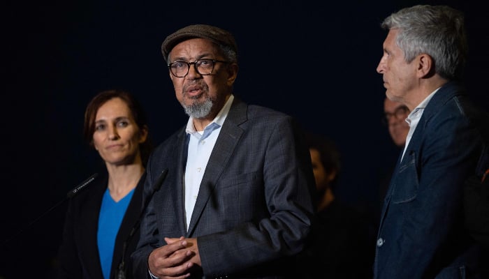 WHO Director-General Tedros Adhanom Ghebreyesus (C) is flanked by Spains Minister of the Interior Fernando Grande-Marlaska (R) and Spains Minister of Health Monica Garcia Gomez speaks to reporters at a command post which is to coordinate evacuation efforts of the passengers and crew of the hantavirus-stricken cruise ship MV Hondius at the industrial port of Granadilla de Abona on the island of Tenerife in Spains Canary Islands on May 9, 2026. — AFP