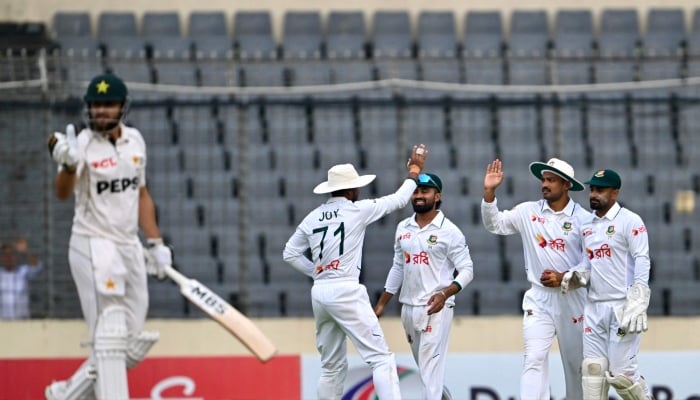 Bangladeshs players celebrate after the dismissal of Pakistan´s Salman Agha during the third day of the first Test cricket match at the Sher-e-Bangla National Stadium in Mirpur, Dhaka, May 10, 2026. — AFP