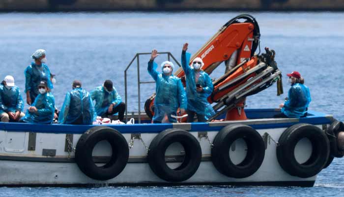 People from the cruise ship MV Hondius, affected by a hantavirus outbreak, are transferred by boat to the port after disembarking, at the port of Granadilla de Abona, in Tenerife, Spain, May 10, 2026.— Reuters