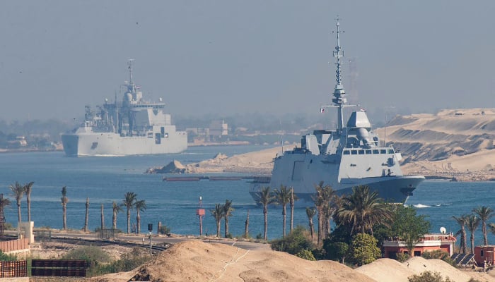 A handout picture released by the Marine Nationale (French Navy) on May 6, 2026, shows the French Navys Carrier Strike Group that includes the flagship aircraft carrier Charles de Gaulle (unseen) and its escort transiting the Suez Canal en route to the southern Red Sea to pre-position for a possible mission to restore navigation in the Strait of Hormuz. — AFP