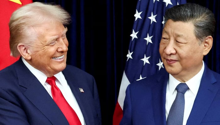 US President Donald Trump and Chinese President Xi Jinping react as they hold a bilateral meeting at Gimhae International Airport, on the sidelines of the Asia-Pacific Economic Cooperation (APEC) summit, in Busan, South Korea, October 30, 2025. — AFP