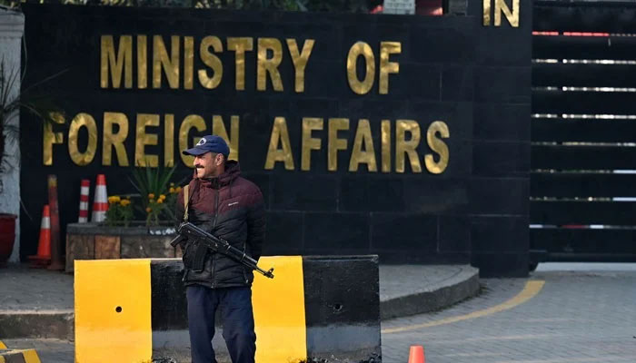 A police officer stands guard outside the ministry of Foreign Affairs in Islamabad on January 18, 2024. — AFP