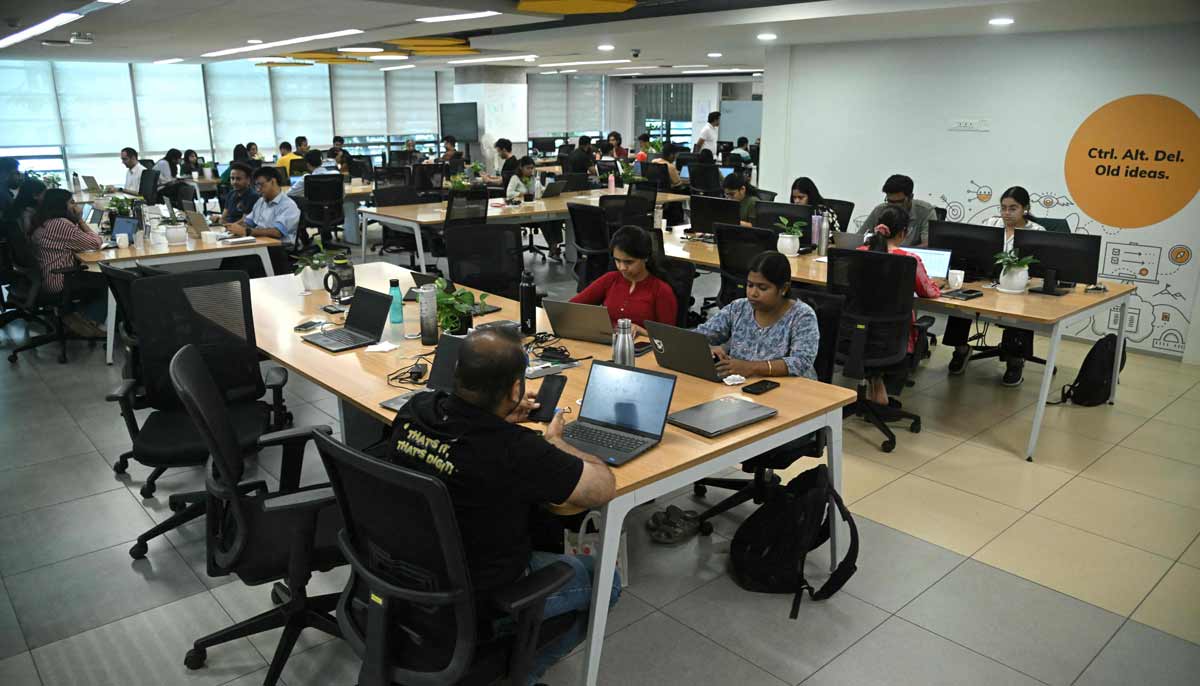 Go Digit Insurance employees working at their office in Bengaluru.— AFP