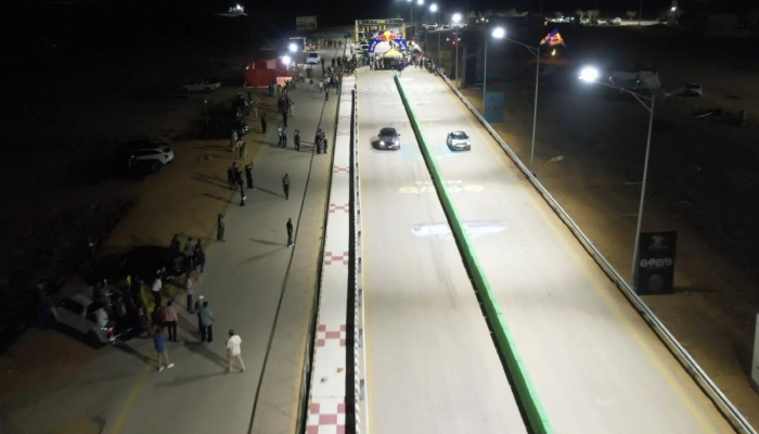Cars race on a floodlit drag strip at a newly prepared motorsports facility in Karachi. — Reporter