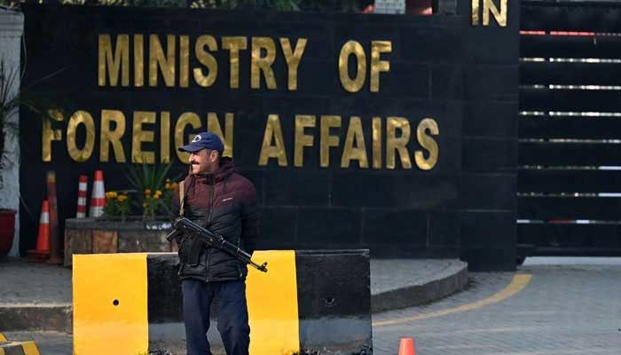 A police officer stands guard outside the Ministry of Foreign Affairs in Islamabad on January 18, 2024. — AFP