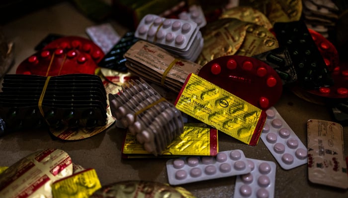 Seized Tapentadol tablets lie on the floor at the National Drug Law Enforcement Agency (NDLEA) facility in Lagos, on February 19, 2026. — AFP