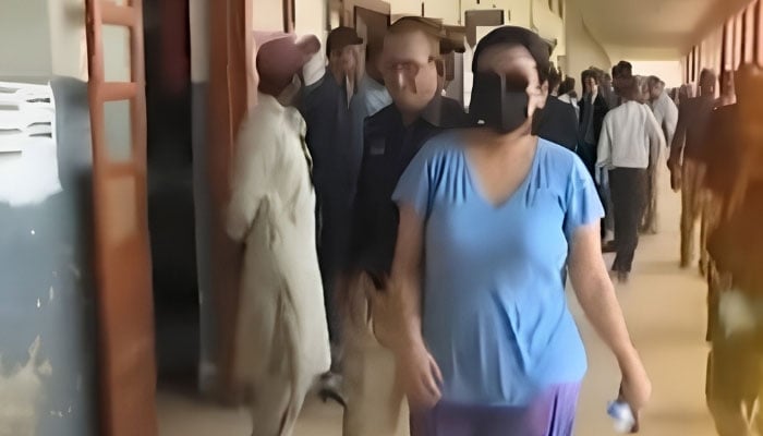 Police produce alleged drug peddler Anmol alias Pinky before a local court in Karachi on May 12, 2026. — YouTube/Geo News/screengrab