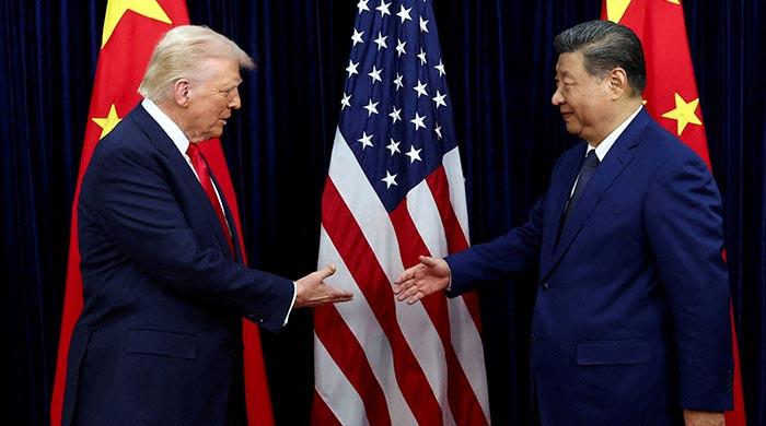 Trump vows to push Xi to 'open up' China at superpower summit