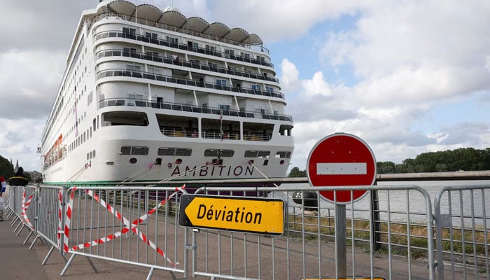 Cruise ship Ambition, operated by the Ambassador Cruise Line, is docked at the Port of Bordeaux after local authorities said passengers could not disembark following an outbreak of possible gastroenteritis reported on board, in Bordeaux, France, May 13, 2026. — Reuters