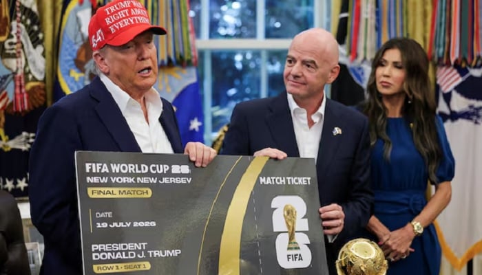 US President Donald Trump and FIFA president Gianni Infantino hold a 2026 FIFA World Cup final match ticket that was presented to President Trump in the Oval Office at the White House in Washington, DC, US., August 22, 2025. — Reuters
