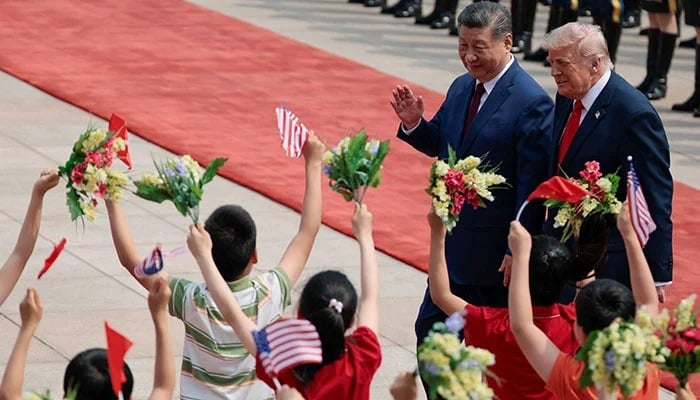 US President Donald Trump arrives during a welcome ceremony at the Great Hall of the People, in Beijing, China, May 14, 2026. — Reuters