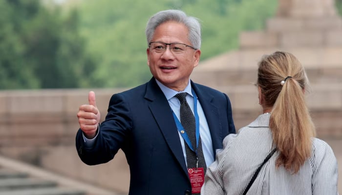 Jensen Huang, Founder, President and CEO of Nvidia, gestures as he leaves after attending a welcome ceremony for US President Donald Trump with Chinese President Xi Jinping at the Great Hall of the People in Beijing, China, May 14, 2026. — Reuters