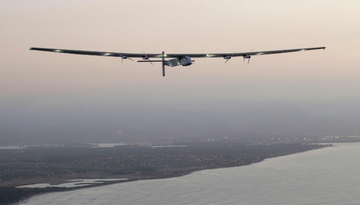 The Solar Impulse 2 solar-powered aeroplane flies off Kapolei, Hawaii, on March 3, 2016, on an all-day test flight. — AFP