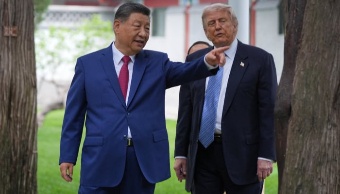 US President Donald Trump talks with China’s President Xi Jinping at the Zhongnanhai leadership compound, Friday, May 15, 2026, in Beijing. — Reuters