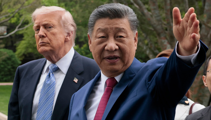 Chinas President Xi Jinping (R) gestures as he meets with US President Donald Trump (L) during a visit to Zhongnanhai Garden in Beijing on May 15, 2026. — AFP