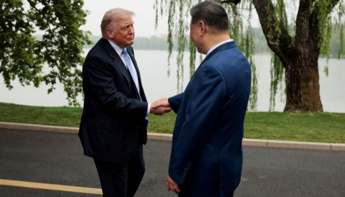 US President Donald Trump is greeted by Chinese President Xi Jinping at Zhongnanhai Garden in Beijing, China, May 15, 2026. — Reuters