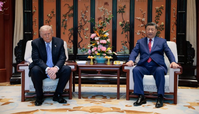US President Donald Trump (L) meets with Chinas President Xi Jinping on the sidelines of their visit to Zhongnanhai Garden in Beijing on May 15, 2026. — AFP