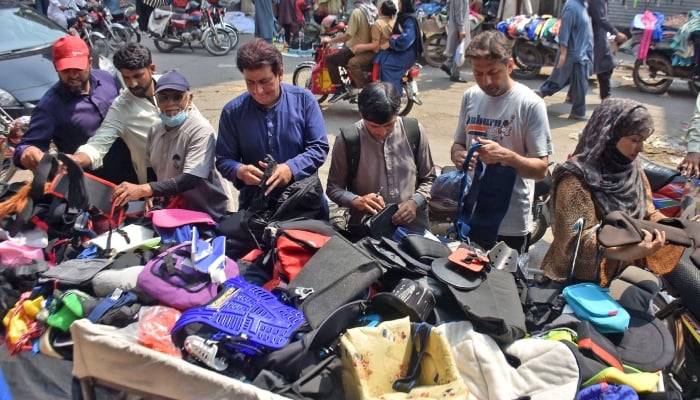 People are buying used items at a Landa bazaar in Lahore, May 5, 2026. — Online