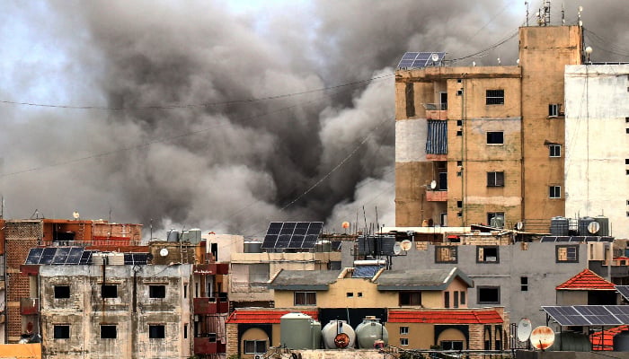 Smoke rises behind buildings following an Israeli airstrike in the southern city of Tyre, Lebanon, on May 15, 2026. — AFP