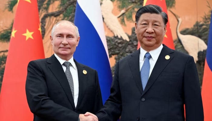 Russian President Vladimir Putin (left) shakes hands with Chinese President Xi Jinping during a meeting at the Belt and Road Forum in Beijing, China, October 18, 2023. — Reuters