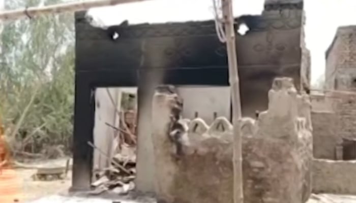 A view of torched house in Jacobabad. — Screengrab via Geo News