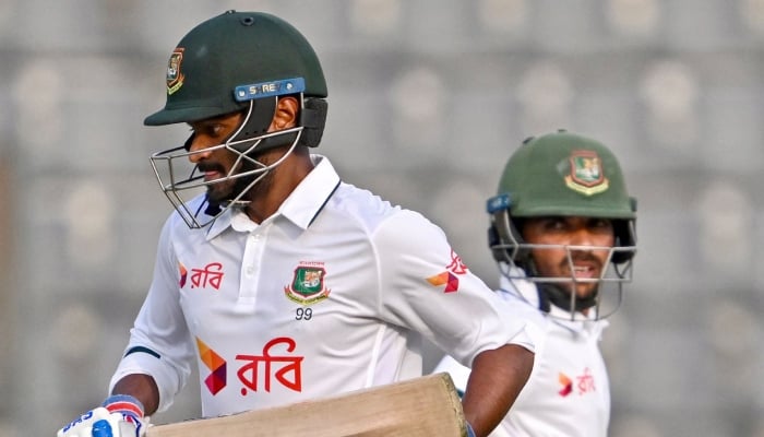 Bangladeshs Mahmudul Hasan Joy (left) and Mominul Haque run between the wickets during the second day of the second Test cricket match against Pakistan at the Sylhet International Cricket Stadium in Sylhet, May 17, 2026. — AFP