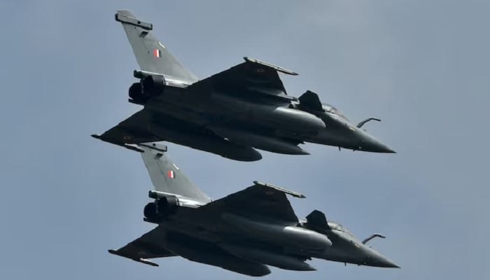 Indian Air Forces Rafale fighter jets fly past during the Aero India 2021 air show at Yelahanka air base in Bengaluru, India, February 3, 2021. — Reuters