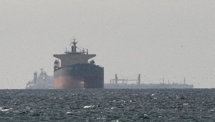 Cargo ships in the Gulf, near the Strait of Hormuz, as seen from northern Ras al-Khaimah, near the border with Oman’s Musandam governance, in the United Arab Emirates, March 11, 2026. — Reuters