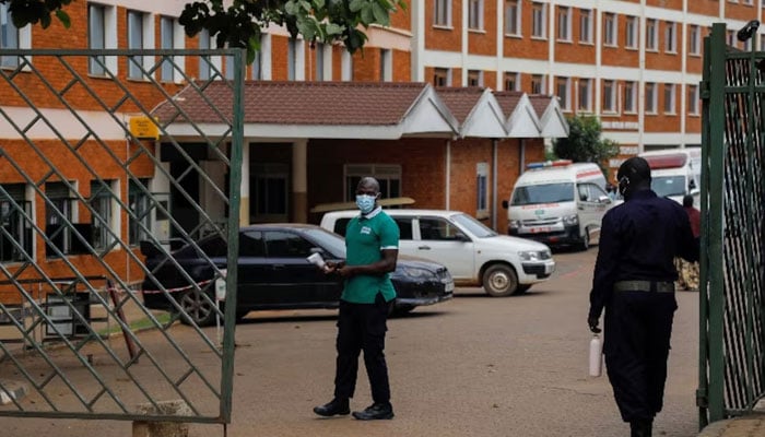 Workers stand guard at the gate of the Kibuli Muslim Hospital where a Congolese man died of Ebola Bundibugyo virus in Kibuli suburb of Kampala, Uganda May 16, 2026. — Reuters