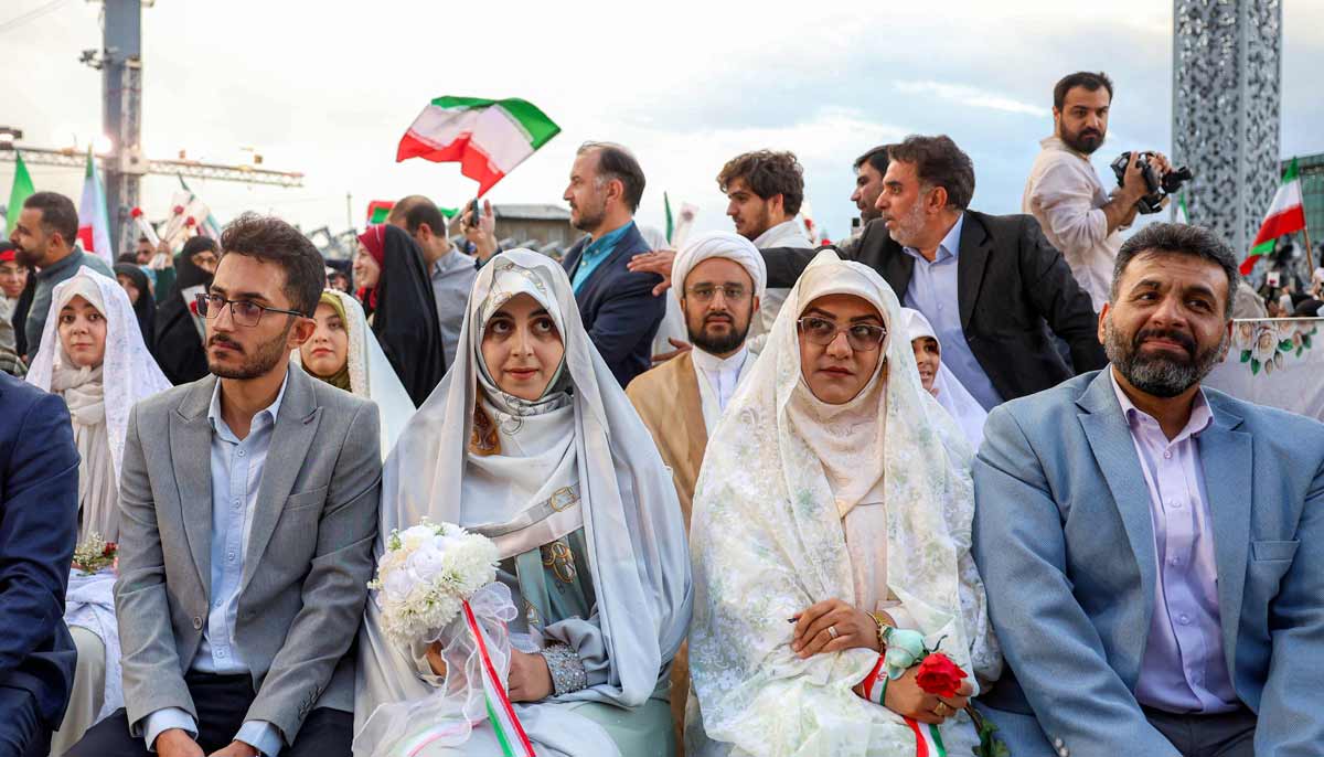 Bride and groom couples attend a public mass wedding ceremony at Imam Hossein Square in Tehran on May 18, 2026.— AFP