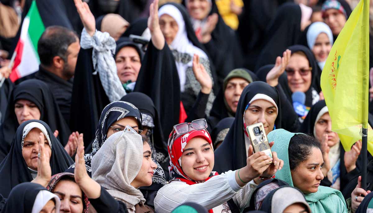 Revellers attend a public mass wedding ceremony at Imam Hossein Square in Tehran on May 18, 2026.— AFP
