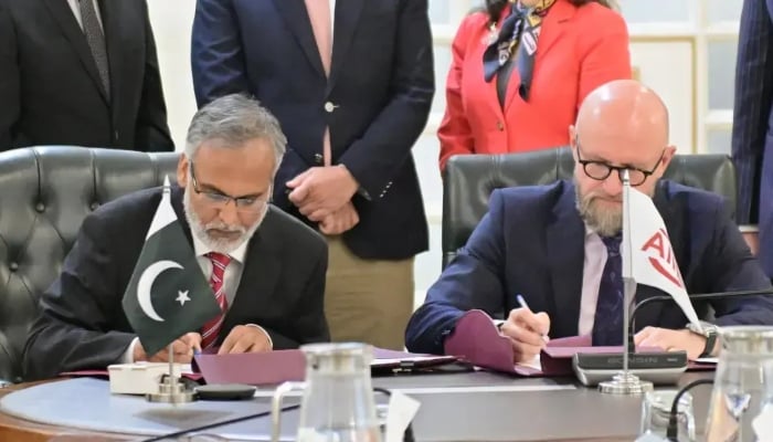 Economic Affairs Division Secretary Muhammad Humair Karim Kidwai (left) and AIIBs Konstantin Limitovskiy sign an agreement in Islamabad, May 19, 2026. — APP