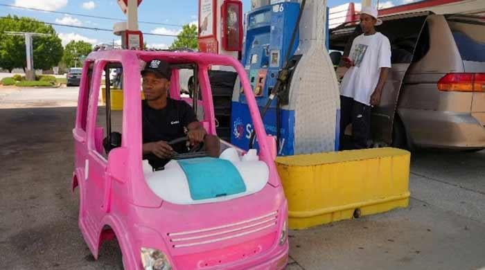High gas prices spur Americans to improvise, from bus rides to toy cars 