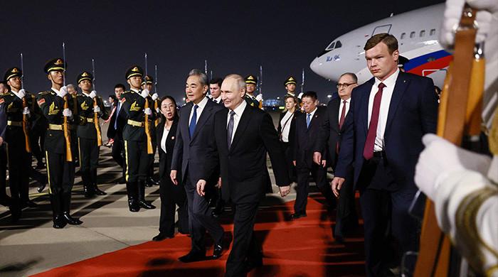 Putin lands in China for trip to show unshakeable ties after Trump pomp