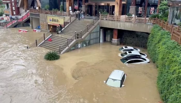 Cars lie partially submerged in floodwaters after heavy rainfall in Duyun, Guizhou Province, China, May 19, 2026, in this still image obtained from a social media video. — Reuters