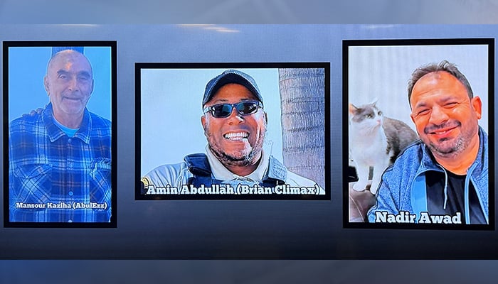 A video monitor shows images of Mansour Kaziha, security guard Amin Abdullah, also known to friends as Brian Climax and Nadir Awad, who were killed during a shooting attack at the Islamic Centre of San Diego, during a news conference at police headquarters in San Diego, California, US May 19, 2026. — Reuters