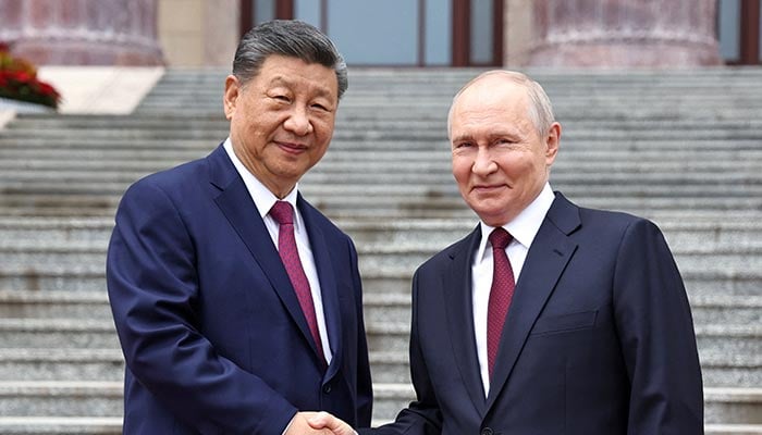 Russian President Vladimir Putin shakes hands with Chinese President Xi Jinping during a welcoming ceremony at the Great Hall of the People in Beijing, China, May 20, 2026. — Reuters