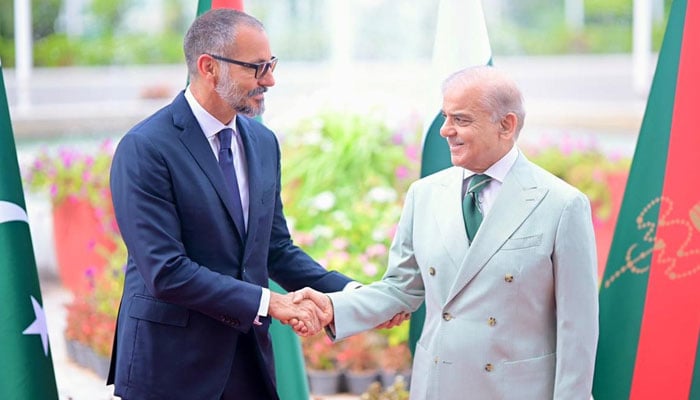 Prime Minister Shehbaz Sharif welcomes Prince Rahim Aga Khan V upon his arrival at PM House on May 21, 2026. — PID