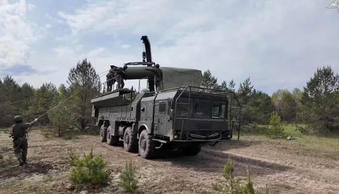 Service members mount a missile on a Russian Iskander-M missile launcher during nuclear forces exercises at an unidentified location in Belarus, in this still image taken from handout footage released on May 21, 2026.— Reuters