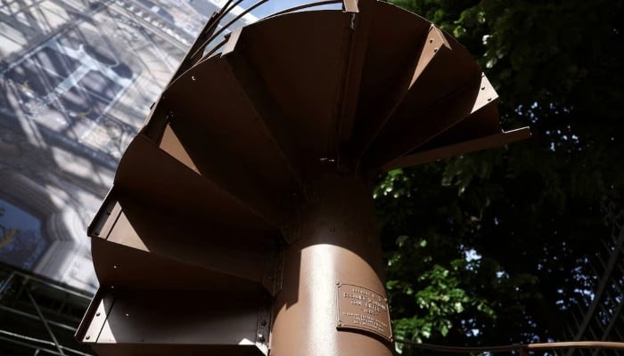 A portion of the original staircase of the Eiffel Tower, built by Gustave Eiffel in 1889, is displayed during a press preview ahead of its upcoming auction organised by Artcurial in Paris, France, May 13, 2026. — Reuters