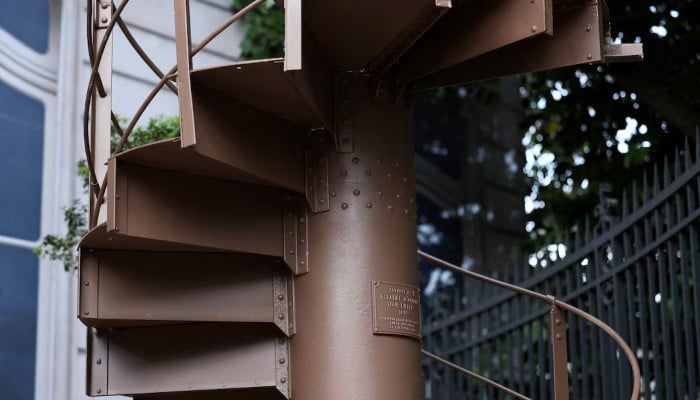 A portion of the original staircase of the Eiffel Tower, built by Gustave Eiffel in 1889, is displayed during a press preview ahead of its upcoming auction organised by Artcurial in Paris, France, May 13, 2026. — Reuters