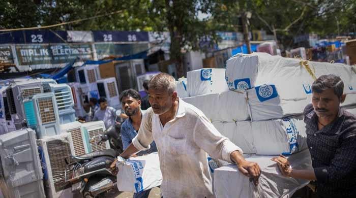 India battles power cuts as heatwave boosts electricity demand to record
