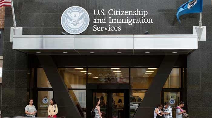 US tells foreigners seeking green cards: Return to your countries to apply