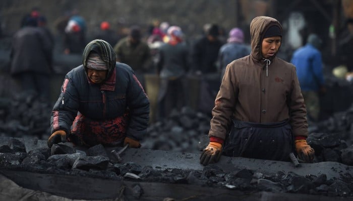 Representational image showing workers sort coal near a mine in Datong, in Chinas northern Shanxi province, in November 2015. — AFP