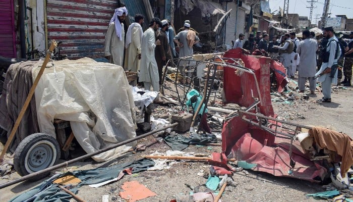 Security personnel inspect the blast site after a suicide attack in the Sarai Naurang area of Lakki Marwat district on May 12, 2026. — AFP