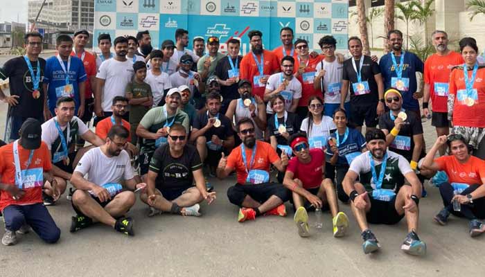Lifebuoy Global One Run Half Marathons participants pose for a group photo. — Reporter
