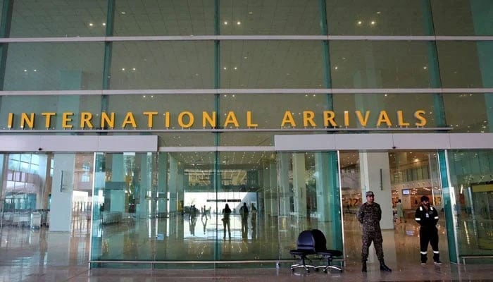 Airport Security Force (ASF) personnel stand guard at the Islamabad International Airport on April 18, 2018. — Reuters