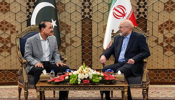 Iranian Parliament Speaker Mohammad Bagher Ghalibaf (right) meets Chief of Defence Forces and Chief of Army Staff Field Marshal Asim Munir in Tehran on May 23, 2026. — Reuters
