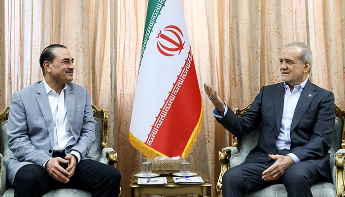 Iranian President Masoud Pezeshkian (right) meets Chief of Defence Forces and Chief of Army Staff Field Marshal Asim Munir in Tehran on May 23, 2026. — Reuters